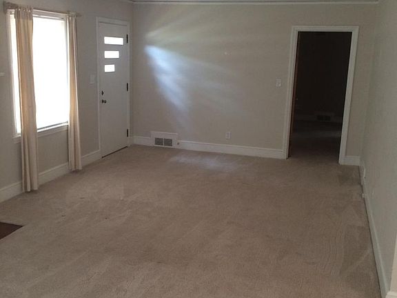 Family room viewing front door and hallway