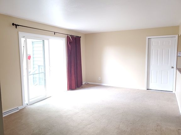 Spacious living room with sliding door to back porch and huge backyard