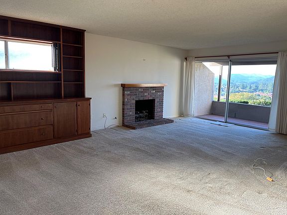 Living Room with Fireplace and built-in bookshelf