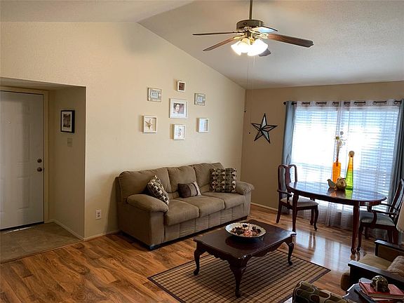 This view is from the hallway area leading into the bedrooms. You can see the front door from here. This living area is perfect for game or movie nights!