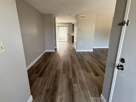 Main entrance. All new vinyl plank flooring throughout unit.