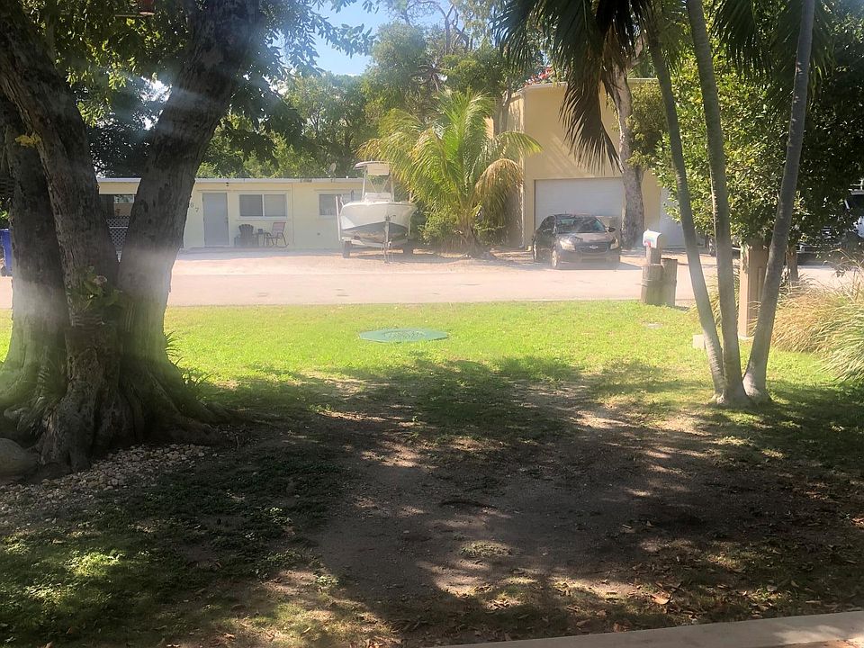 Nice shaded front porch and parking.