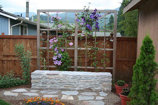 Rock bench beside garden shed