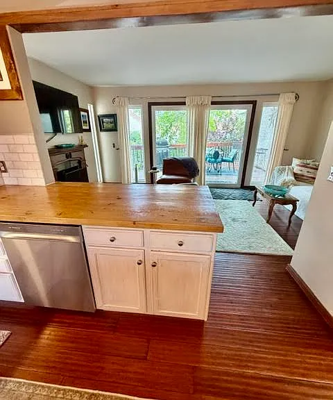Hardwood floors throughout the first floor, along with two large decks, the kitchen, pantry, dining room, living room with a gas fireplace, bathroom and laundry.