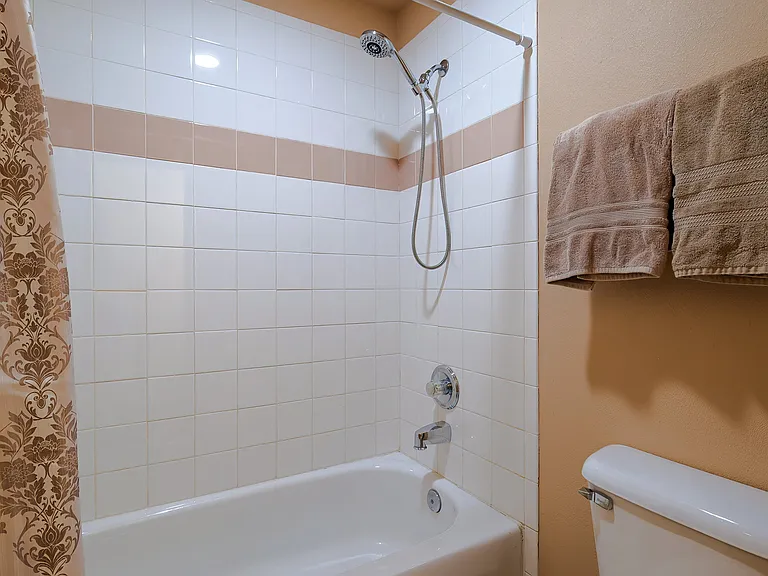 Third floor bedroom with private vanity and bathroom