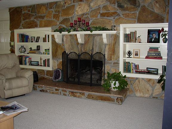 den fireplace flagstone wall