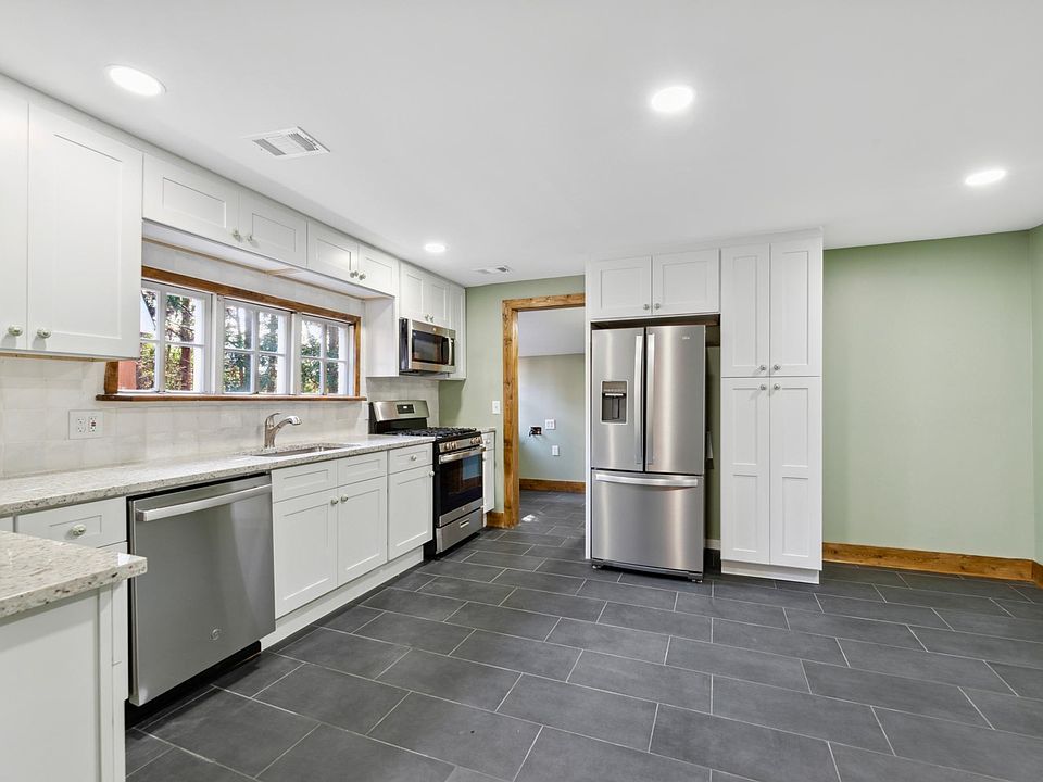 Newly renovated kitchen with new stainless steel appliances.