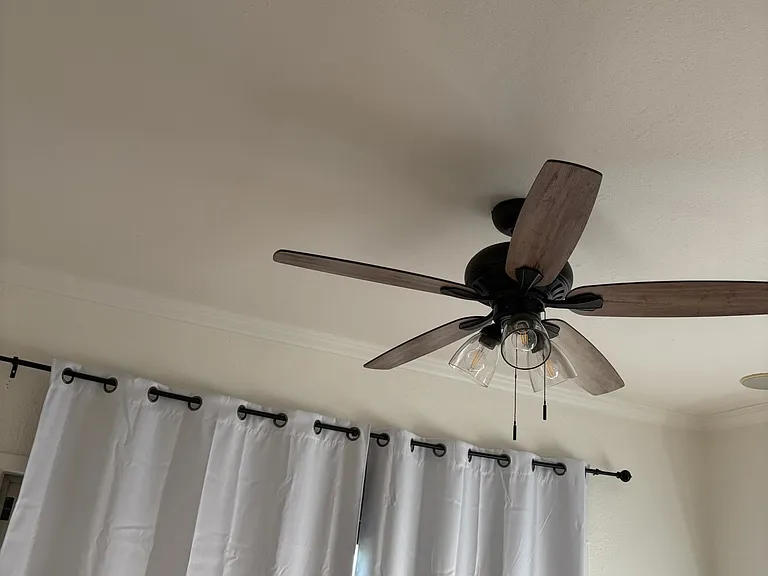 Five new ceiling fans with light kits
This is the Arizona room with new zero sun black out curtains leading to the patio and pool with tie backs on the wall.