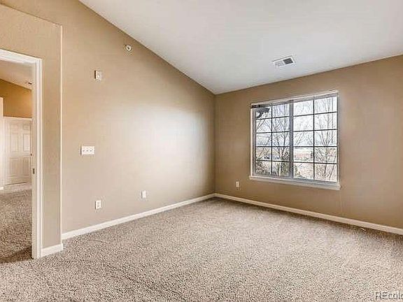 Master bedroom with en-suite bath and vaulted ceilings.