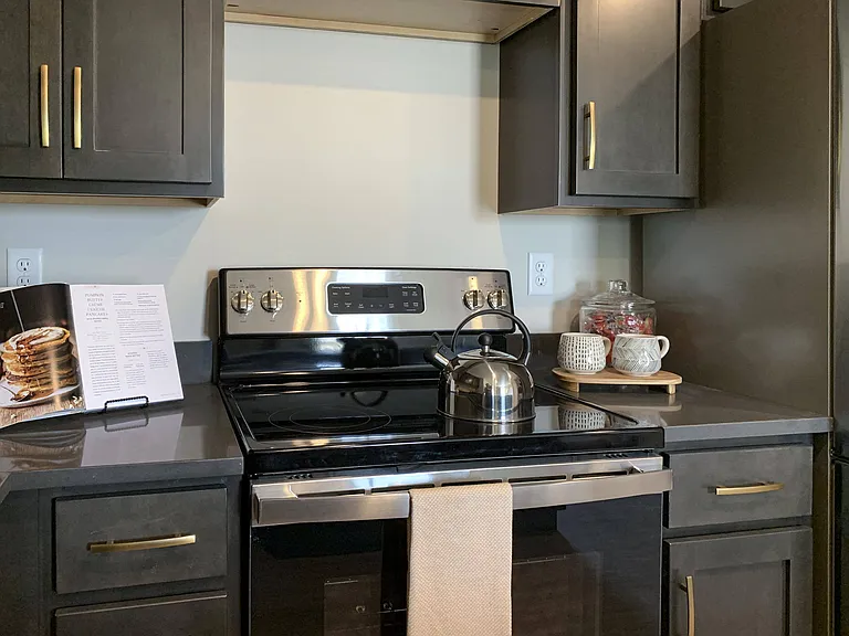 Sleek appliances and plenty of cabinet storage adorn our kitchens.