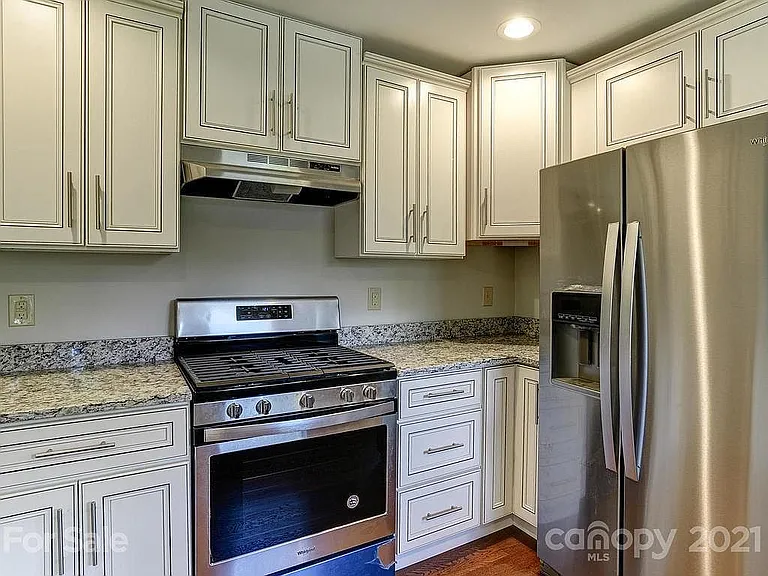 Granite countertops. Custom cabinets. Large fridge. Gas stove.