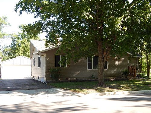 side view showing the cement driveway and double detached garage