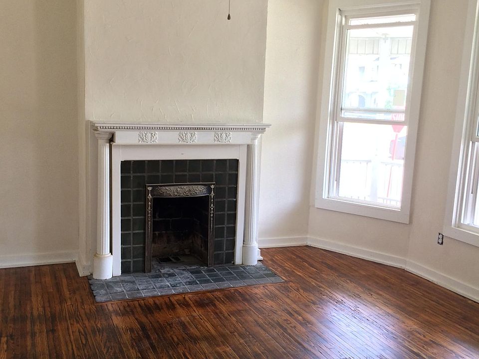 Front room with ceiling fan and double pane windows