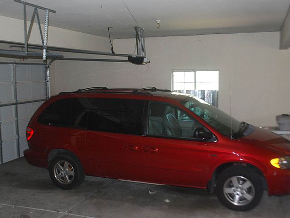 Big, 2-car oversized garage has workshop area and storage. Is 2-car lengths long.