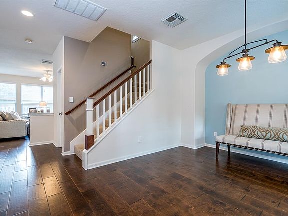 Updated farmhouse chandelier. This space could also be perfect for a home office.