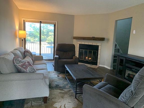 Spacious living room with walk out deck and gas fireplace.