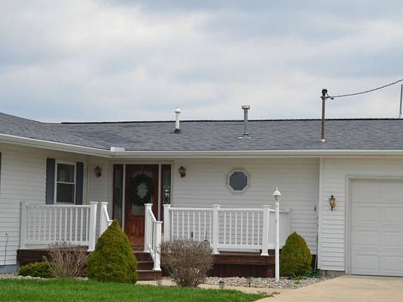 The front entrance is nicely landscaped and brings your guest right up to the front entrance of the home.  