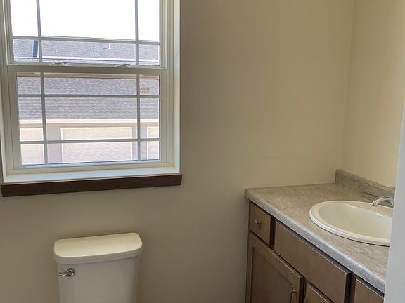 Full bath with shower and linen closet.
