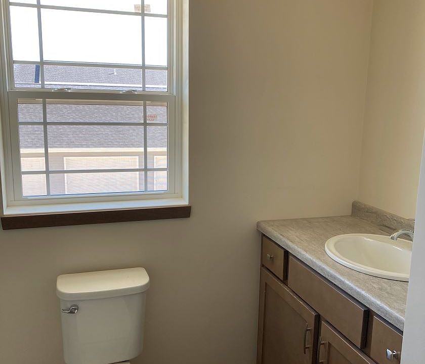 Full bath with shower and linen closet.
