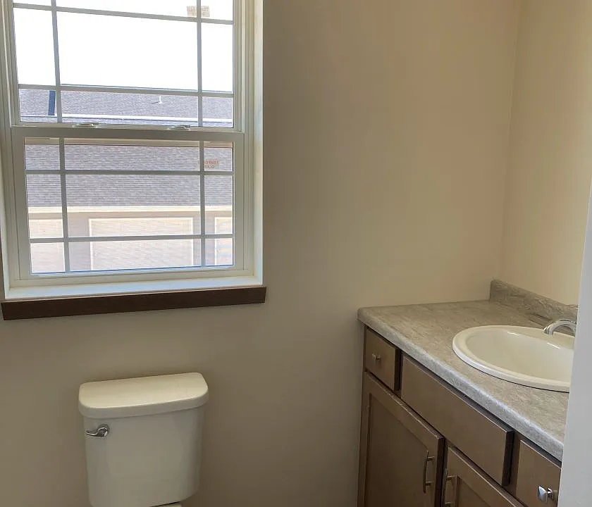 Full bath with shower and linen closet.