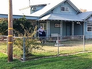 Front of home - fence yard - front porch swing