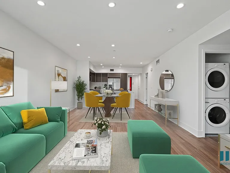 Kitchen, Dining, and Living Room Area with In-Suite Washer & Dryer