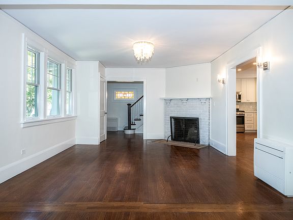 Entry hall leads to spacious living room and open kitchen