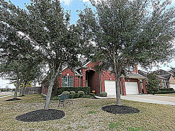 AS YOUR GUESTS ARRIVE THEY ARE GREETED BY ATTRACTIVE CURB APPEAL AND A COVERED ENTRY