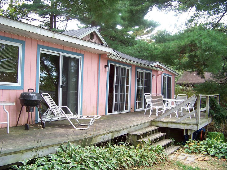 4 sliders lead to deck w/a unbelievable view of the lake