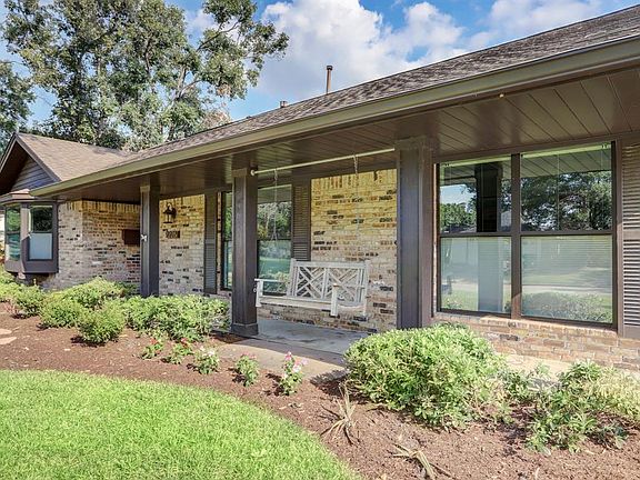 Fresh landscaping and a large front porch greet you.