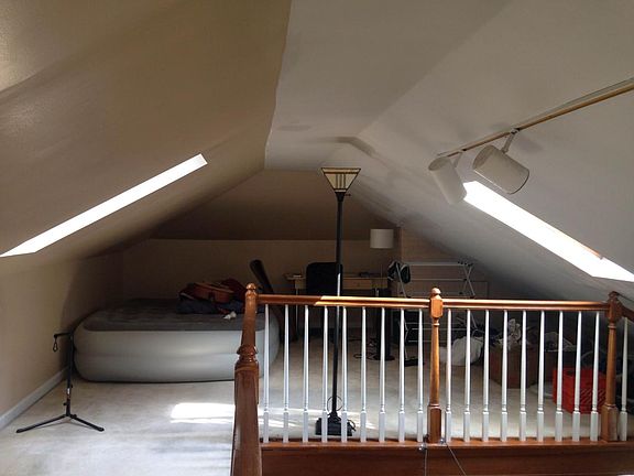 Lofted office space overlooking living room