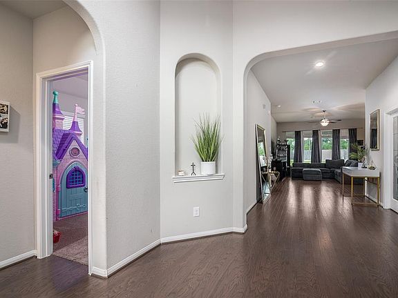 Extra wide entrance hall with architectural charms.