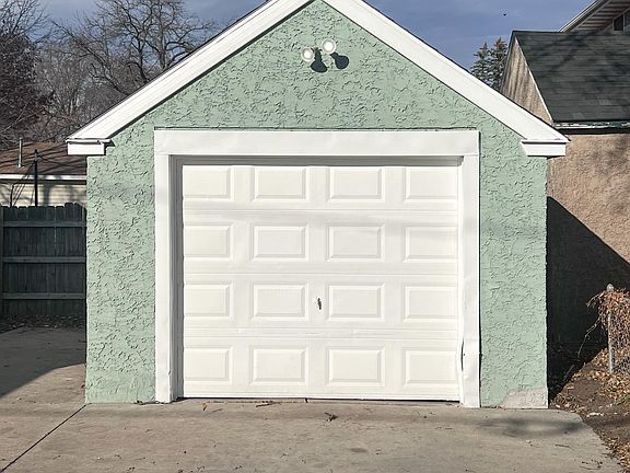 One stall garage with ample parking in driveway. Large work bench and shelving for storage.