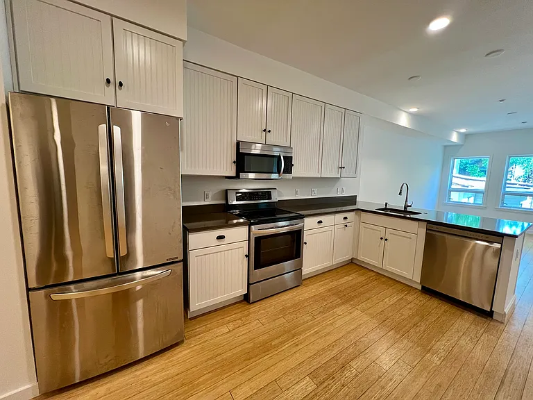 Open kitchen beside living room.