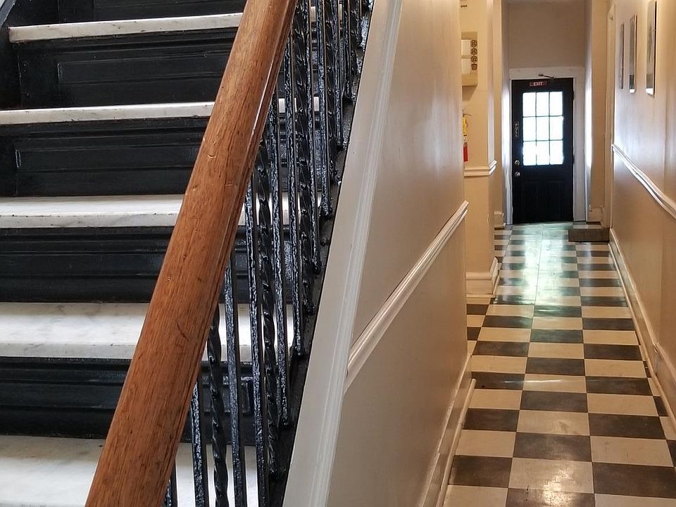 This pre-war building has been meticulously restored to it's classic 1940's finish including marble stairs and black cast iron railings.
