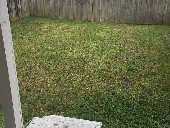Flat fenced in back yard