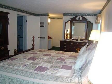 Master Bedroom
						:
						With an attached vanity area and master bath, this master bedroom is complete.