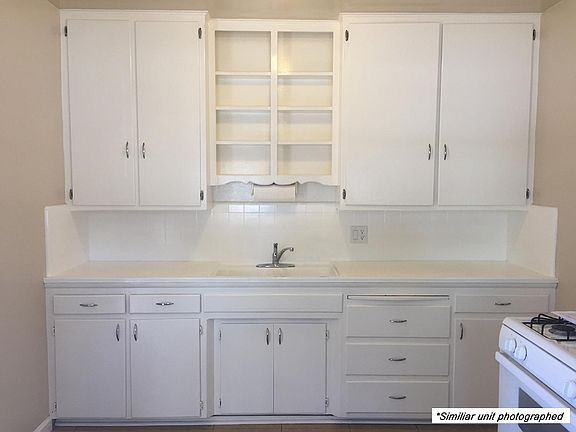 ** SIMILAR UNIT PICTURED ** Kitchen has door access to private backyard.