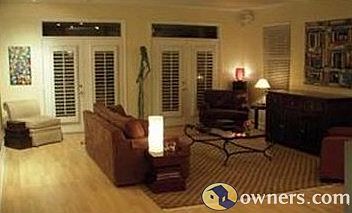 Comfortable family room; track-lit gallery walls for art