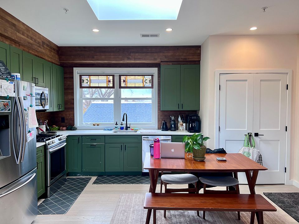Kitchen with a skylight, and washer/dryer in the closet to the right.