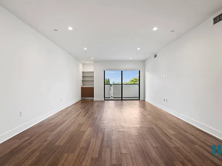 Open-Concept Dining and Living Room with Patio