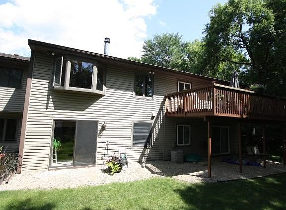 Back of home shows nice deck off dining room.