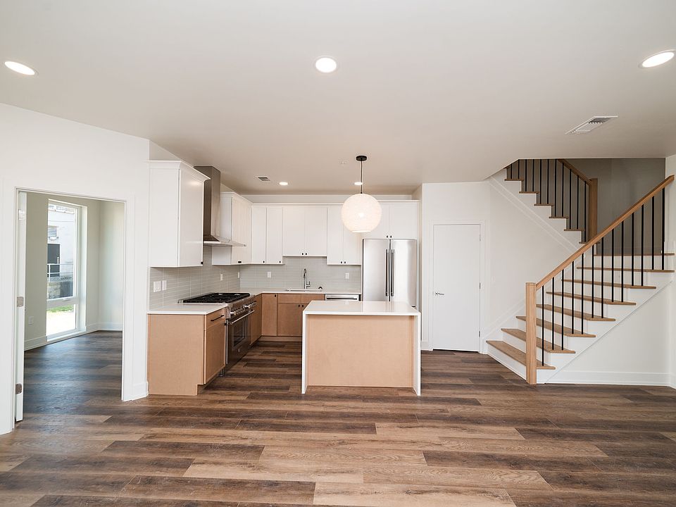 Kitchen and Open Concept Dining/Living Room, Access to 2nd Floor, 1st Bedroom