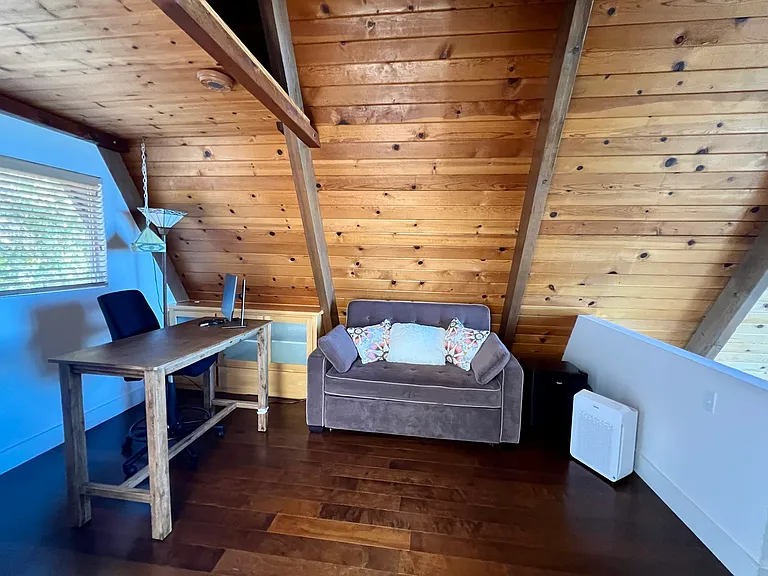 Couch and desk in loft area