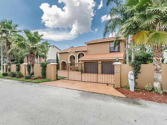 Front Exterior - Fresh paint on house, driveway, private gate
