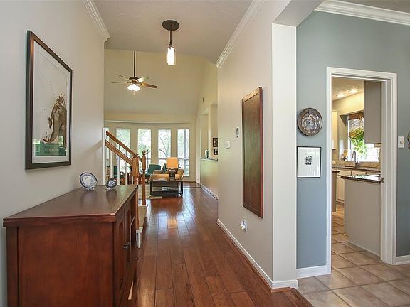 The Gracious Entryway has Crown Molding, Hardwood Flooring and Updated Lighting.