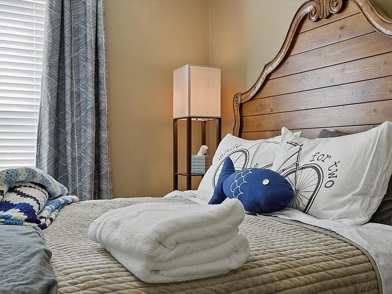 Larson's Room at Hunsucker's Place features a plush memory foam bed, warm decor, and natural light. Conveniently located near Downtown Greensboro and Cone Health Hospital, this cozy space provides comfort and charm in a beautifully central home.