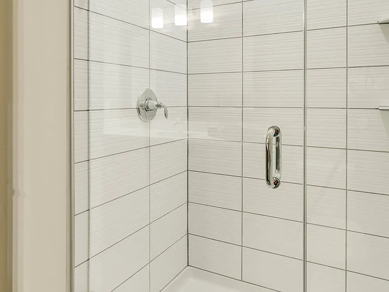 Some bathrooms feature beautifully tiled walk-in showers instead of a tub.