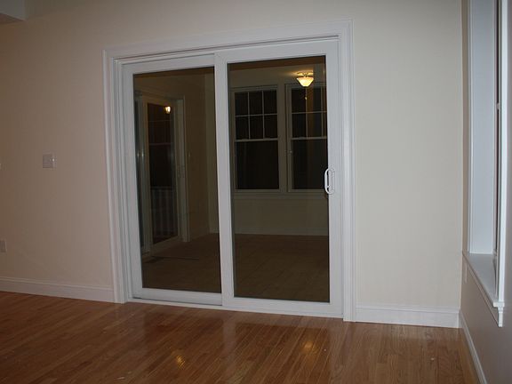 Sunroom with view of the woods
