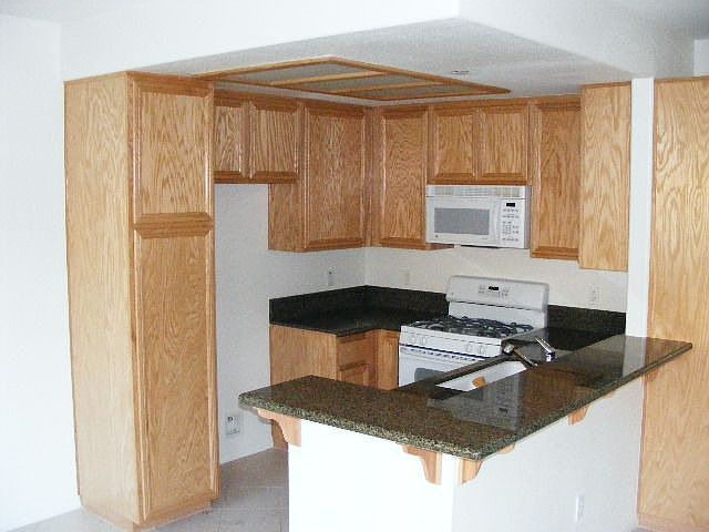 Wonderful Kitchen with granite counters and oak cabinets!